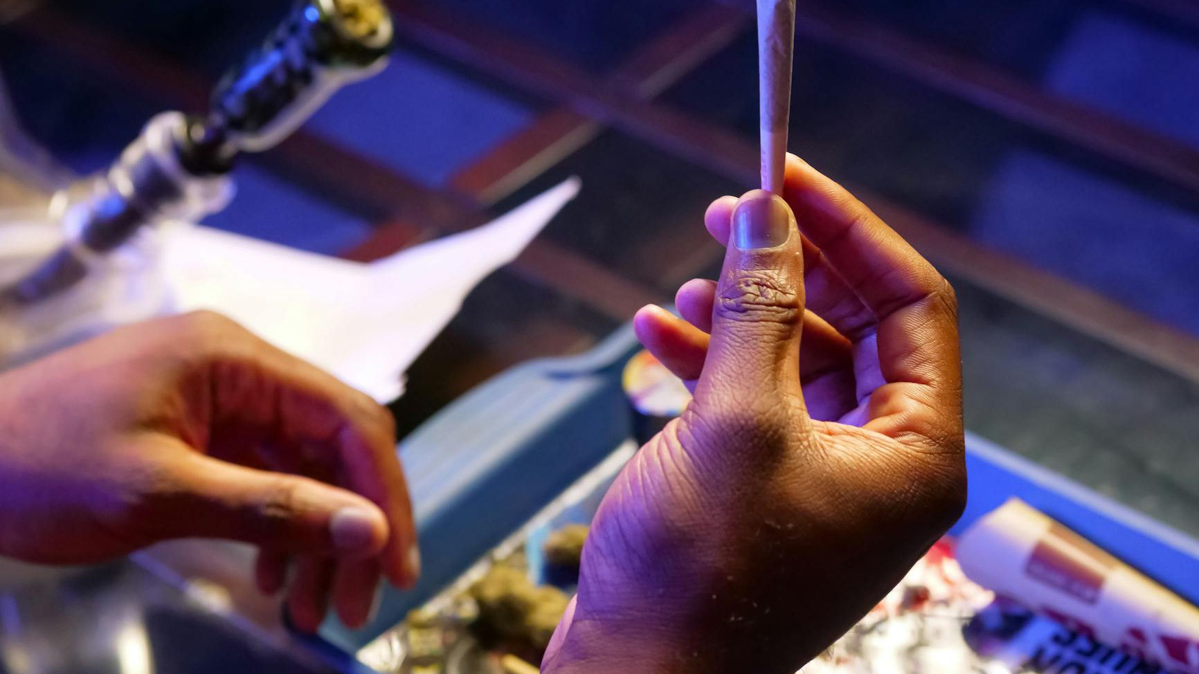 close up photo of person holding blunt