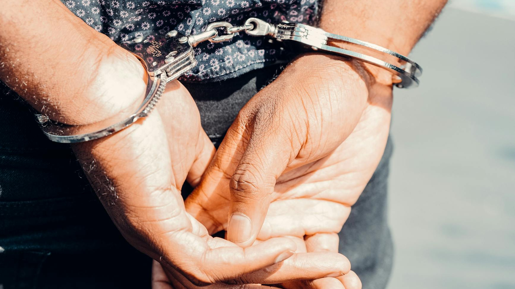 close up photography of person in handcuffs